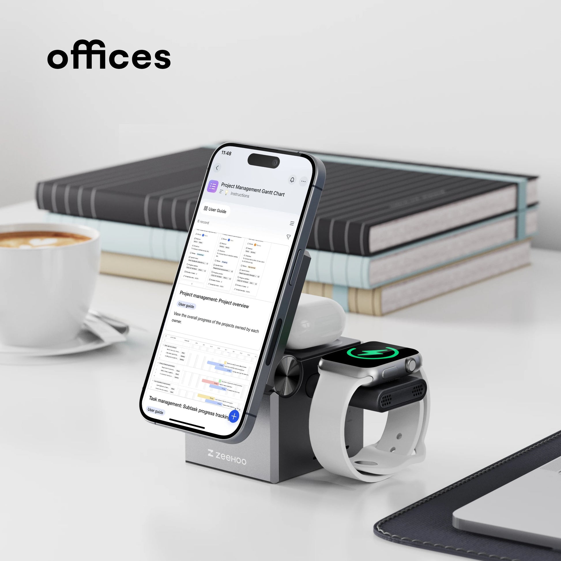 Smartphone and smartwatch on a charging stand with office items in the background